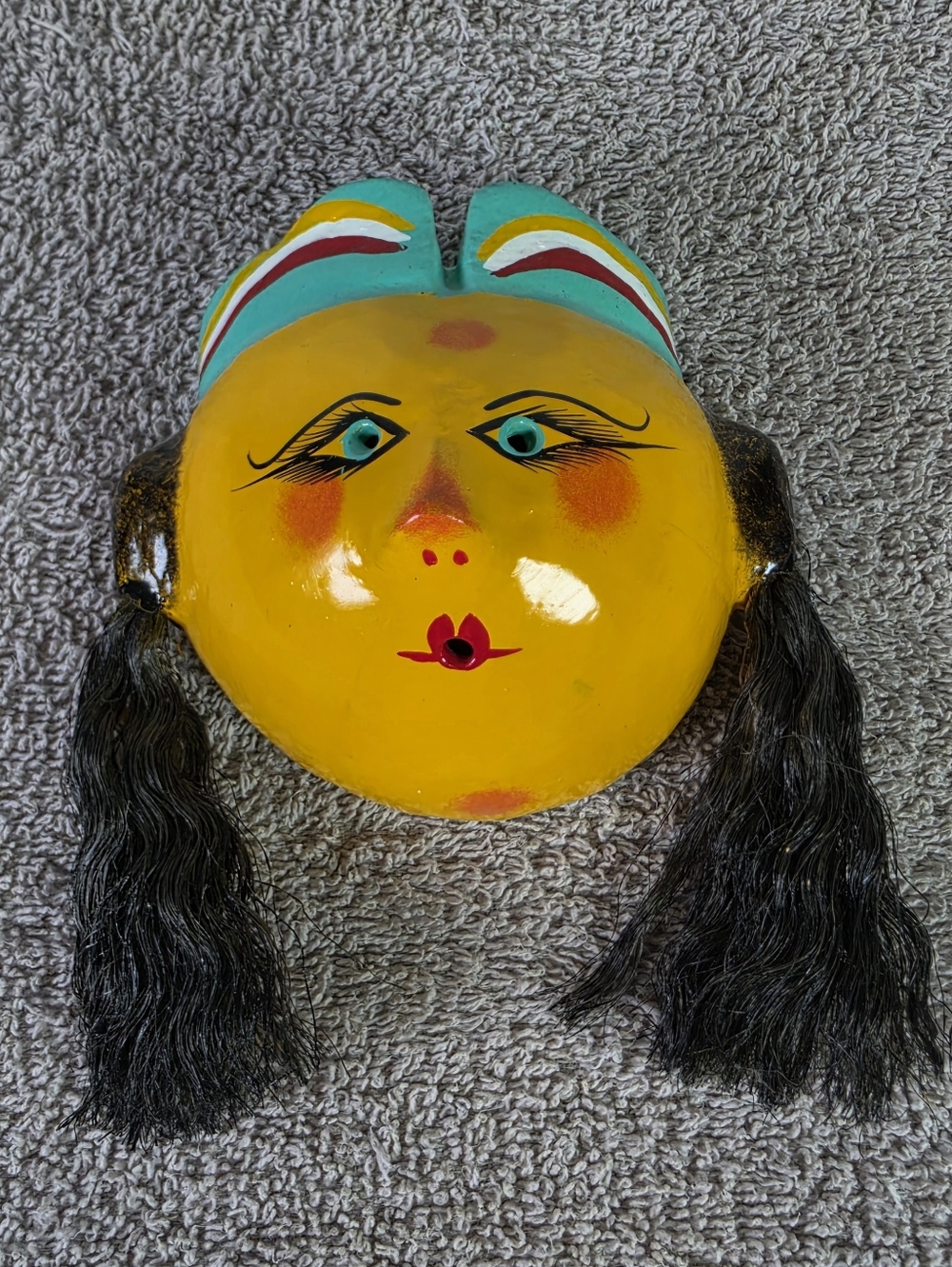Hand-Painted Yellow Decorative Mask with Black Hair Accents